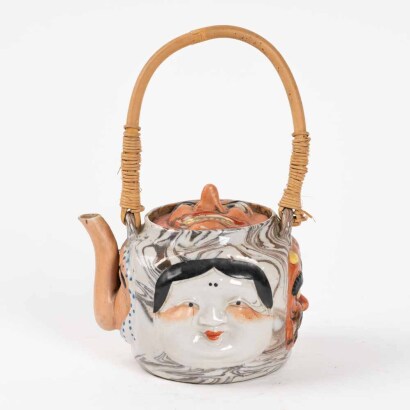 A Japanese early to mid 20th century Banko Ware Noh mask teapot