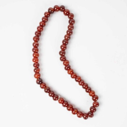 A Chinese red agate necklace