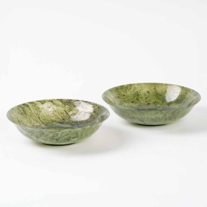 A pair of Chinese Qing dynasty spinach-green jade bowls