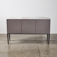 A Contemporary Sideboard With A Marble Top