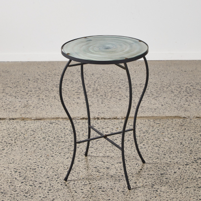 An Iron Side Table With A Textured Glass Spiral Top