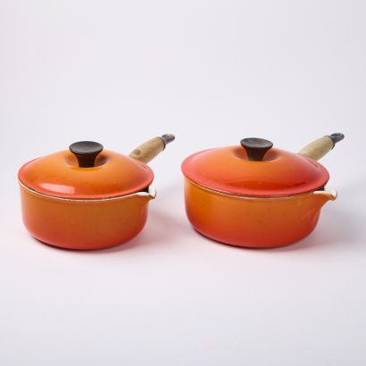 A Pair of Le Creuset 20" and 18" Cast Iron Saucepans