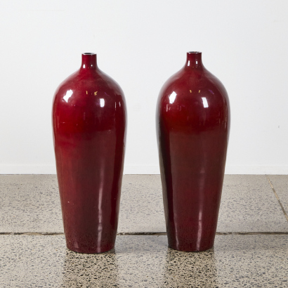 A Pair of Large Red Ceramic Floor Vases