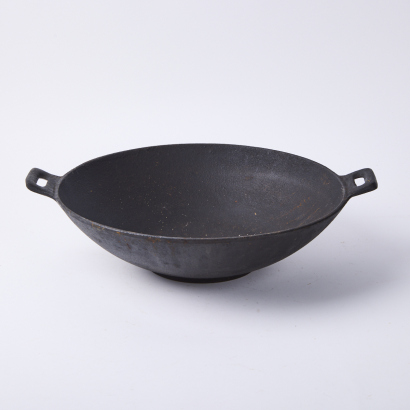 A Vintage Cast Iron Wok