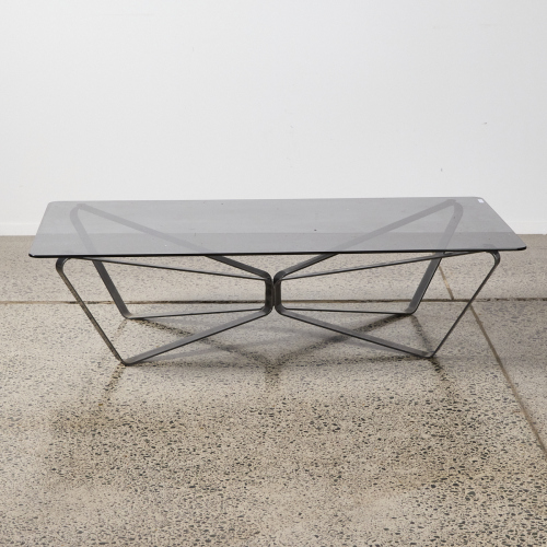 A Contemporary Smoked Glass Coffee Table With Geometric Base