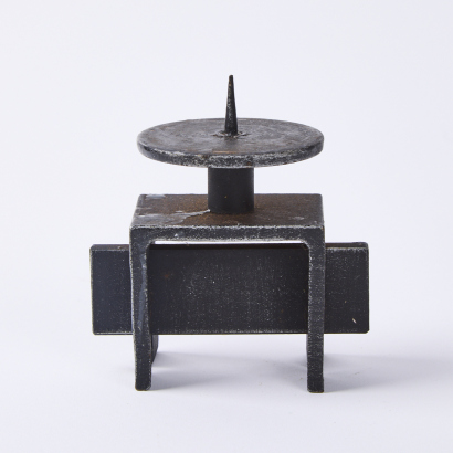 A Brutalist Cast Iron Candle Holder