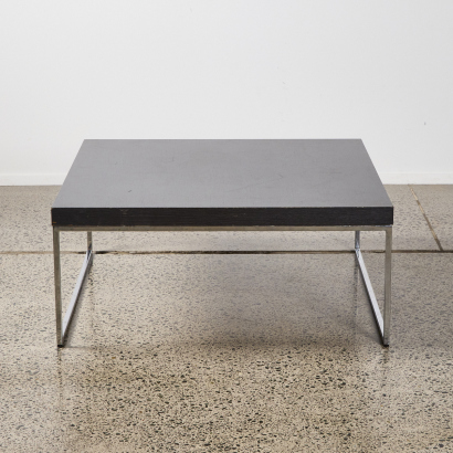 A Designer Coffee Table With Metal Sleigh Base