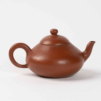 A Chinese red stoneware pear-shaped teapot (Mengchen Mark)