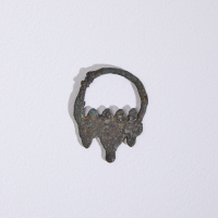 An Egyptian bronze earring 