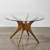 An Okto-B Glass Topped Round Table