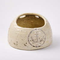 A Vintage Ceramic Planter With Illustrative Details