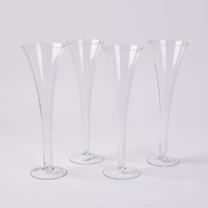 A Set Of Four Hollow Stemmed Crystal Champagne Flutes