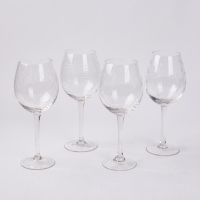 A Set Of Four Crystal Etched Large Wine Glasses