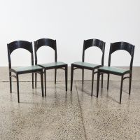 A Set of Four Mid-Century Italian Black Lacquer Dining Chairs