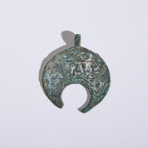 A Bronze Islamic Lunate Pendant