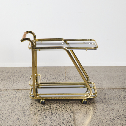 A Retro Brass Cocktail Trolley With Mirrored Glass Base