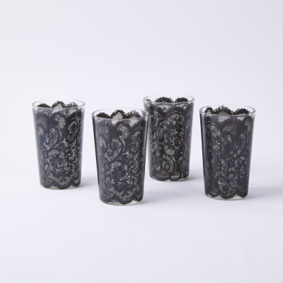 A Collection Of Four Tumblers With Lace Pattern