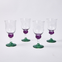 A Set Of Four Bubble Stem Wine Glasses