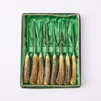 A Boxed Set Of Eight Antler Handle Steak Knives