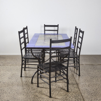 A Moroccan Style Tile And Steel Outdoor Dining Set