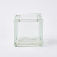 A Small Square German Glass Brick Vase