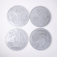 A Set of Four Oversized New Zealand Coin Wall Hangings