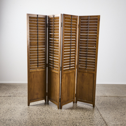 A Wooden Privacy Screen with Shutters