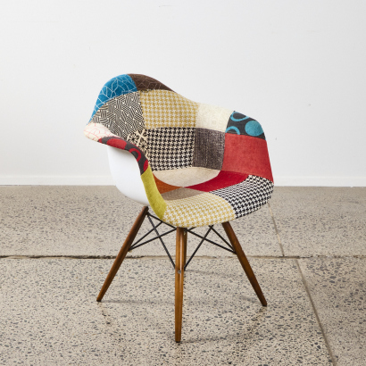 A Patchwork Occasional Chair in the style of Charles and Ray Eames