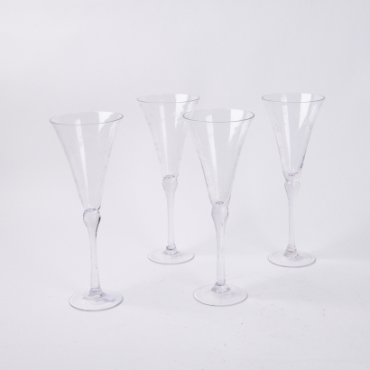 A Set Of Four French Country Etched Champagne Flutes