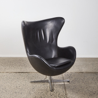 An Arne Jacobsen Style Black Leather Egg Chair