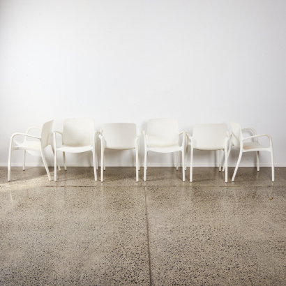 A Suit Of Six Stackable Polypropylene Chair With Armrests