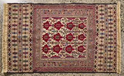 An Intricate Hand Knotted Afghan Rug