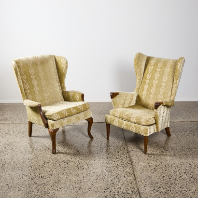 A Pair of Upholstered Wing Back Chairs