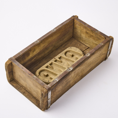 A Wooden 'Anna' Brick Mould