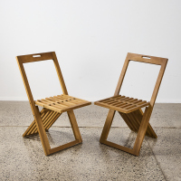 A Pair Of Teak Folding Chairs