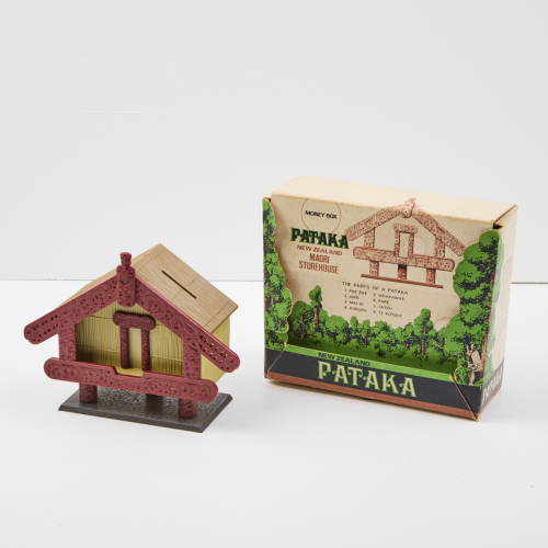 A Rare Pataka Money Box, Extant In The Original Three Colour Illustrated Cardboard Box Manufactured By UEB Industries
