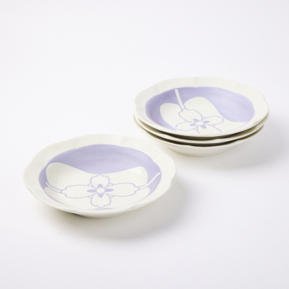 A Set of Four Purple Pansy Decorated Bowls