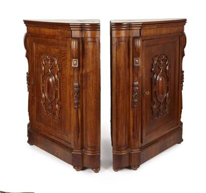 A Pair of Walnut Standing Corner Cupboards