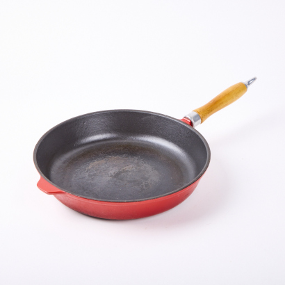 A Red Cast Iron Frying Pan