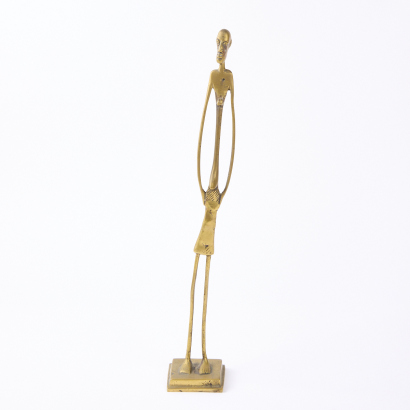 A Brass Elongated Figure