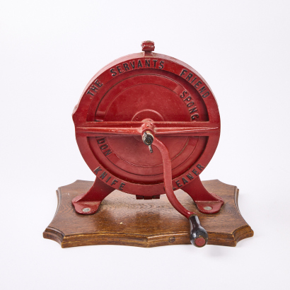 An Antique Cast Iron Rotary Knife Cleaner on Oak Stand