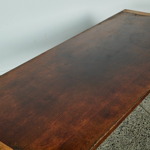 A Large Oak Table With A Steel Frame