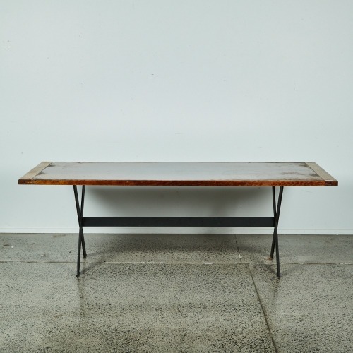 A Large Oak Table With A Steel Frame