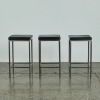 A Trio of Black Chrome Stools