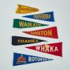 A Collection Of Seven Vintage Travel Flags