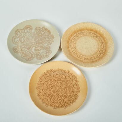 A Set of Three Mustard Dinner Plates