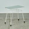 An Atomic Glass Topped Console Table