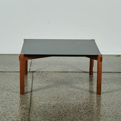 A Scandinavian Style Coffee Table with Black Top and Wood Frame