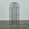A Tall Arched Wine Rack Holds 38 Bottles