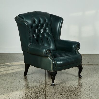 A Wing-Backed Leather Library Chair